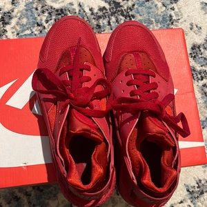 Red Nike huarache. Worn. Good condition. Still lots of life